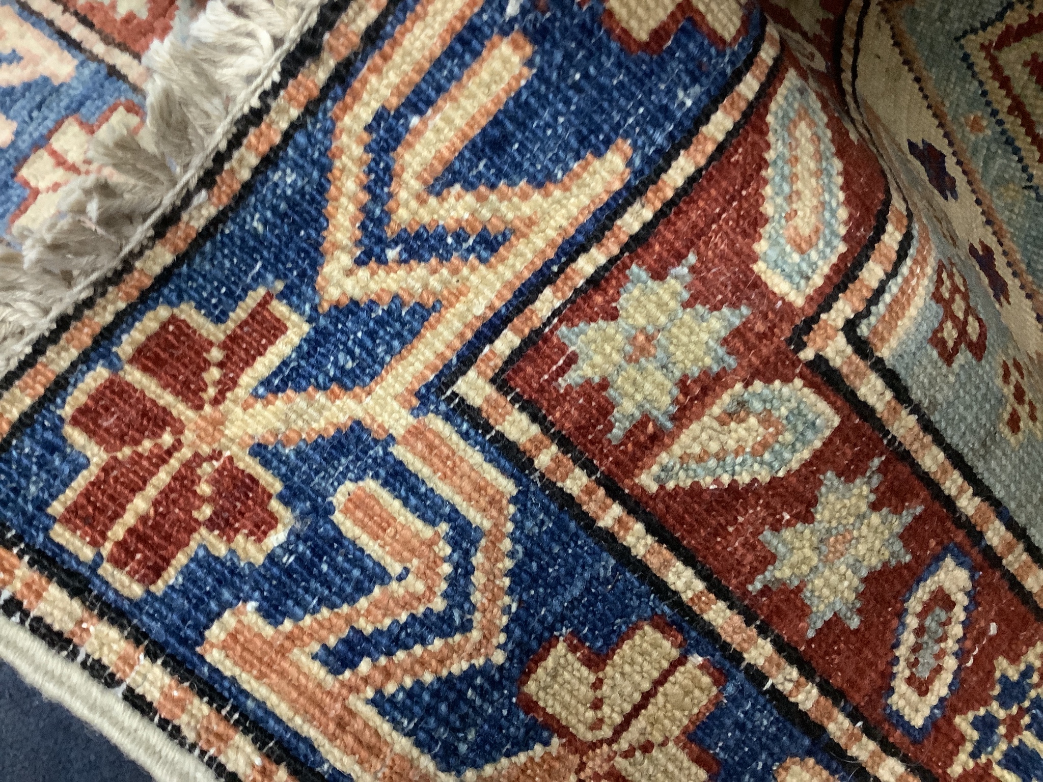 A Caucasian design ivory ground runner, 280 x 70cm